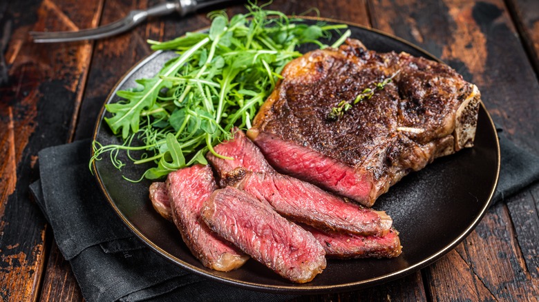 Grilled and sliced steak on plate